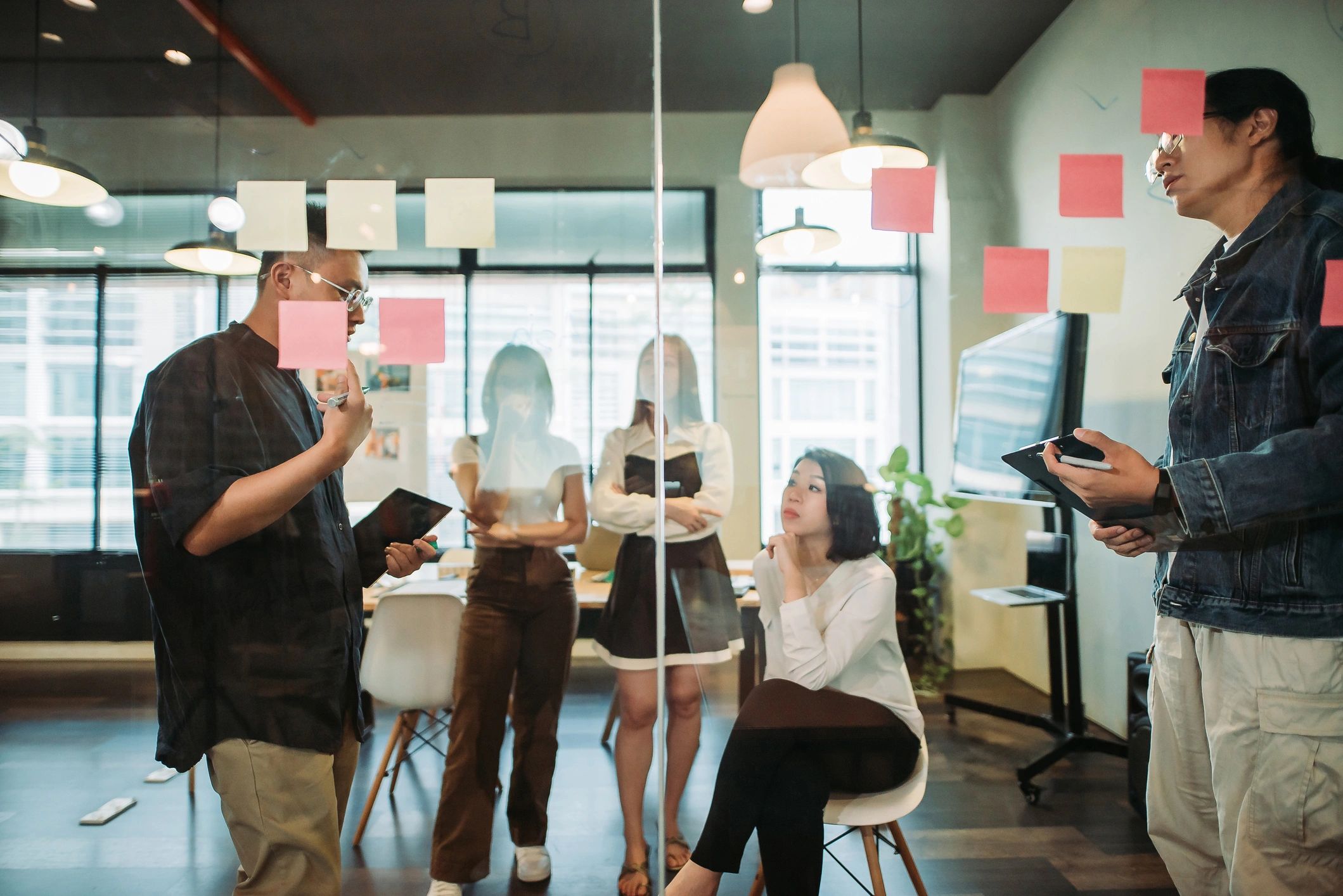 Creative team collaborating during a branding presentation